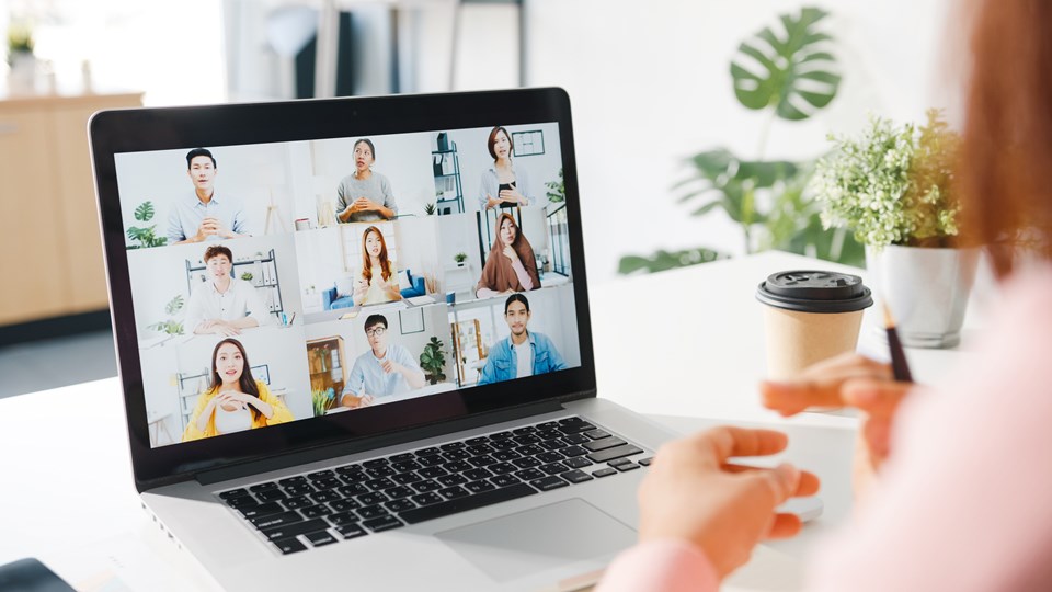 young-asia-businesswoman-using-laptop-talk-to-colleague-about-plan-in-video-call-meeting-while-work-from-home-at-living-room